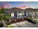 Beautiful exterior elevation of a two-story home with a large driveway and attached garage at 6566 S Goldenrod Rd # 82A, Orlando, FL 32822