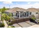 Beautiful exterior elevation of a two-story home with a large driveway and attached garage at 6566 S Goldenrod Rd # 82A, Orlando, FL 32822