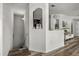 Bright hallway with staircase and decorative shelving leading to additional rooms at 6566 S Goldenrod Rd # 82A, Orlando, FL 32822