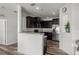 Modern kitchen with stainless steel appliances and dark wood cabinets at 6566 S Goldenrod Rd # 82A, Orlando, FL 32822