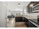 Modern kitchen overlooks the living room, with stainless appliances and an open concept at 6566 S Goldenrod Rd # 82A, Orlando, FL 32822