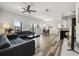 Spacious living area seamlessly connects to the dining area, showcasing modern furnishings and natural light at 6566 S Goldenrod Rd # 82A, Orlando, FL 32822