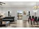 Bright open-concept living space with modern decor and an adjacent dining area at 6566 S Goldenrod Rd # 82A, Orlando, FL 32822