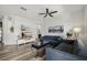 Open-concept living room featuring contemporary decor, sleek furnishings, and stylish wood floors at 6566 S Goldenrod Rd # 82A, Orlando, FL 32822