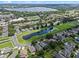 Gorgeous aerial shot of a neighborhood featuring mature trees, community ponds and beautiful single-Gathering homes at 6720 Winder Lynne Ln, Orlando, FL 32819