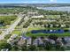 Stunning aerial view of a residential area boasting picturesque ponds, mature trees, and well-kept streets at 6720 Winder Lynne Ln, Orlando, FL 32819