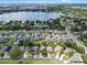 Aerial view of a home nestled in a residential area with mature trees, well-kept lawns, and community streets at 6720 Winder Lynne Ln, Orlando, FL 32819