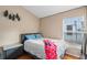 Comfortable bedroom with stylish furnishings and natural light at 6720 Winder Lynne Ln, Orlando, FL 32819