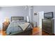Cozy bedroom features wood floors, a ceiling fan, and neutral wall color at 6720 Winder Lynne Ln, Orlando, FL 32819