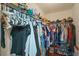 Walk-in closet featuring ample hanging storage and shelving for shoes at 6720 Winder Lynne Ln, Orlando, FL 32819