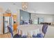 The dining area is open to the kitchen and includes a dining set under modern light fixture at 6720 Winder Lynne Ln, Orlando, FL 32819