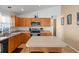 Spacious kitchen featuring oak cabinets and neutral countertops at 6720 Winder Lynne Ln, Orlando, FL 32819