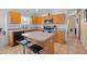 Contemporary kitchen with central island and eat-in breakfast bar seating at 6720 Winder Lynne Ln, Orlando, FL 32819