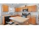 Modern kitchen featuring stainless steel appliances and ample counter space at 6720 Winder Lynne Ln, Orlando, FL 32819