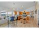 Bright kitchen features island with breakfast bar, natural light, and oak cabinetry at 6720 Winder Lynne Ln, Orlando, FL 32819