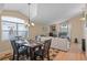 Open-concept living and dining area featuring abundant natural light, neutral tones, and comfortable seating at 6720 Winder Lynne Ln, Orlando, FL 32819