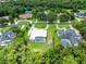 Aerial view of a home in a neighborhood with landscaped yards and mature trees at 740 Bear Creek Cir, Winter Springs, FL 32708