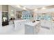 Bright, open kitchen with dual islands, modern appliances, and a seamless flow into the living area at 740 Bear Creek Cir, Winter Springs, FL 32708