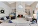 Cozy living room showcasing a fireplace, custom shelving, and comfortable seating at 740 Bear Creek Cir, Winter Springs, FL 32708