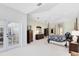 Bright and airy main bedroom boasts a four-poster bed, dressers and french door to the backyard at 740 Bear Creek Cir, Winter Springs, FL 32708