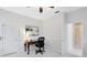 Well-lit office space featuring a desk, chair, neutral carpet, and an abstract piece of artwork at 740 Bear Creek Cir, Winter Springs, FL 32708