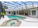 Enclosed pool and spa with patio seating, ideal for outdoor relaxation and entertaining at 740 Bear Creek Cir, Winter Springs, FL 32708