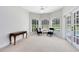 Cozy sitting room with pool access, comfortable chairs, and ample natural light at 740 Bear Creek Cir, Winter Springs, FL 32708