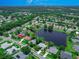 Beautiful aerial view of a lakeside community featuring lush landscaping and mature trees at 800 Sterling Chase Dr, Port Orange, FL 32128
