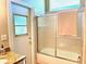 Bathroom featuring a glass-enclosed shower and modern fixtures at 800 Sterling Chase Dr, Port Orange, FL 32128