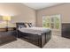Bedroom featuring neutral walls, plush carpet, and dark furniture that provides ample storage space at 800 Sterling Chase Dr, Port Orange, FL 32128