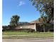 Brick sign for the Sterling Chase community featuring manicured landscaping and mature trees at 800 Sterling Chase Dr, Port Orange, FL 32128