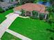 Beautiful single-story home with a three-car garage, manicured lawn, and pristine landscaping at 800 Sterling Chase Dr, Port Orange, FL 32128