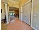 Foyer with tile flooring, archways, columns, and views into the living spaces beyond at 800 Sterling Chase Dr, Port Orange, FL 32128