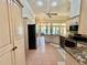 Spacious kitchen with stainless steel appliances, granite countertops, and tile floor at 800 Sterling Chase Dr, Port Orange, FL 32128