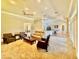 Large living area seamlessly connects to an open floor plan featuring a kitchen and multiple seating areas at 800 Sterling Chase Dr, Port Orange, FL 32128