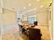Bright living room with plush seating, neutral tones and flooded with natural light from the French doors at 800 Sterling Chase Dr, Port Orange, FL 32128