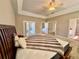 Spacious main bedroom boasts trey ceilings, plush carpet, and direct access to the outdoor living area at 800 Sterling Chase Dr, Port Orange, FL 32128