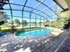 Screened-in pool and patio overlooking a beautiful lake view at 800 Sterling Chase Dr, Port Orange, FL 32128