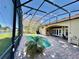 Screened-in pool and patio area featuring a lake view and outdoor seating at 800 Sterling Chase Dr, Port Orange, FL 32128