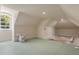 Spacious attic with natural light streaming through a large arched window at 8542 Eden Park Rd, Orlando, FL 32810