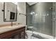 Modern bathroom featuring tiled shower and granite countertop at 8542 Eden Park Rd, Orlando, FL 32810