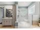 Spacious bathroom with a large walk-in shower and elegant vanity with storage at 8542 Eden Park Rd, Orlando, FL 32810