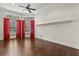 Bedroom with window views and red curtains at 8542 Eden Park Rd, Orlando, FL 32810