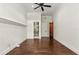 Bedroom with bathroom access and a dark ceiling fan at 8542 Eden Park Rd, Orlando, FL 32810