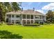 Stately home exterior with pristine lawn, perfect for outdoor enjoyment at 8542 Eden Park Rd, Orlando, FL 32810