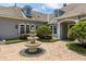 Elegant three-tier fountain with brick and stone accents at 8542 Eden Park Rd, Orlando, FL 32810