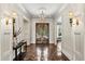Elegant foyer boasts marble floors, ornate chandelier, and stunning stained glass doors at 8542 Eden Park Rd, Orlando, FL 32810