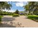 Brick driveway with professionally landscaped circular gardens at 8542 Eden Park Rd, Orlando, FL 32810