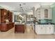 Bright kitchen featuring granite countertops, stainless steel appliances, and custom cabinetry at 8542 Eden Park Rd, Orlando, FL 32810