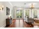 Bright living room with hardwood floors, french doors leading to patio at 8542 Eden Park Rd, Orlando, FL 32810